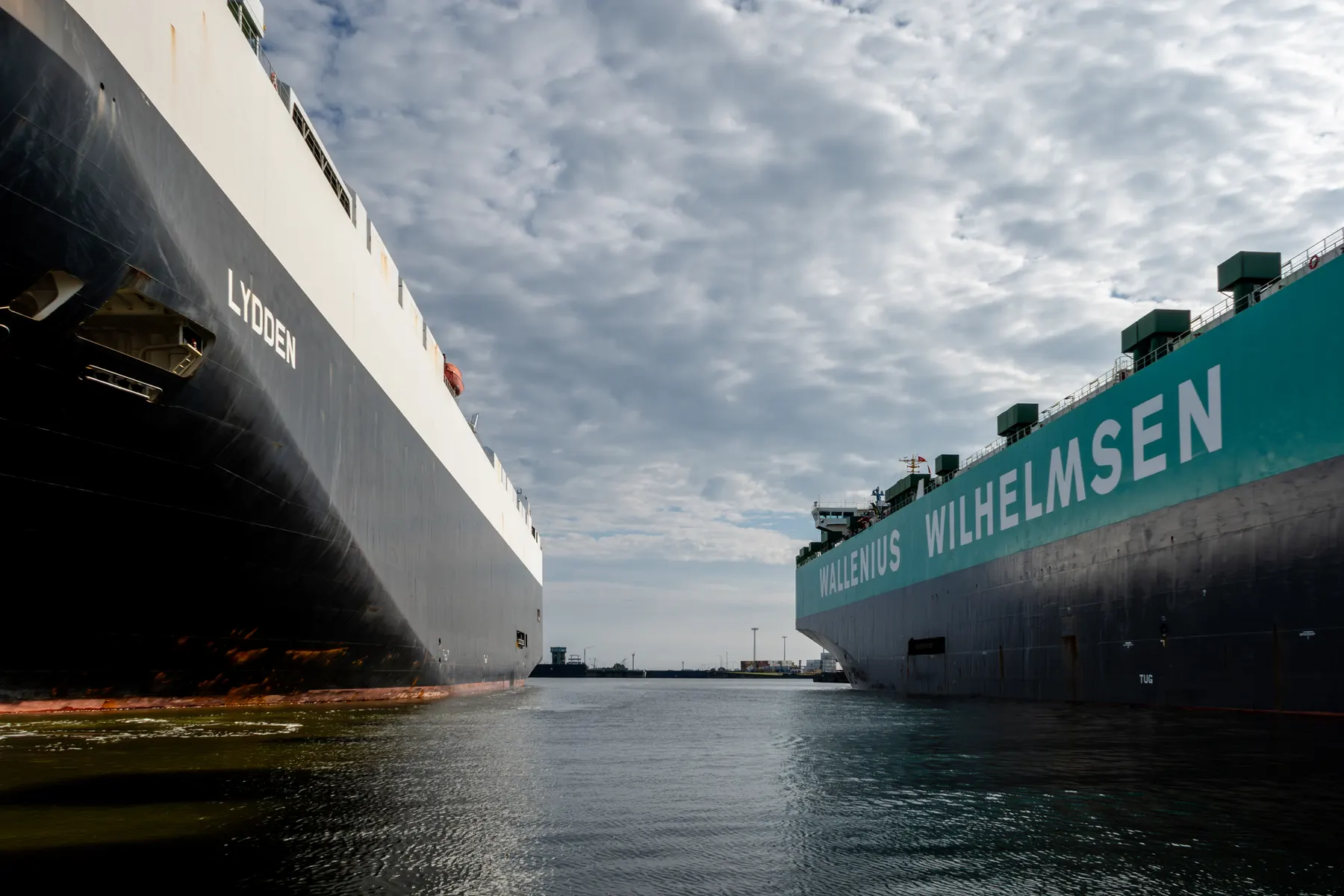 Two car carriers alongside at an export port